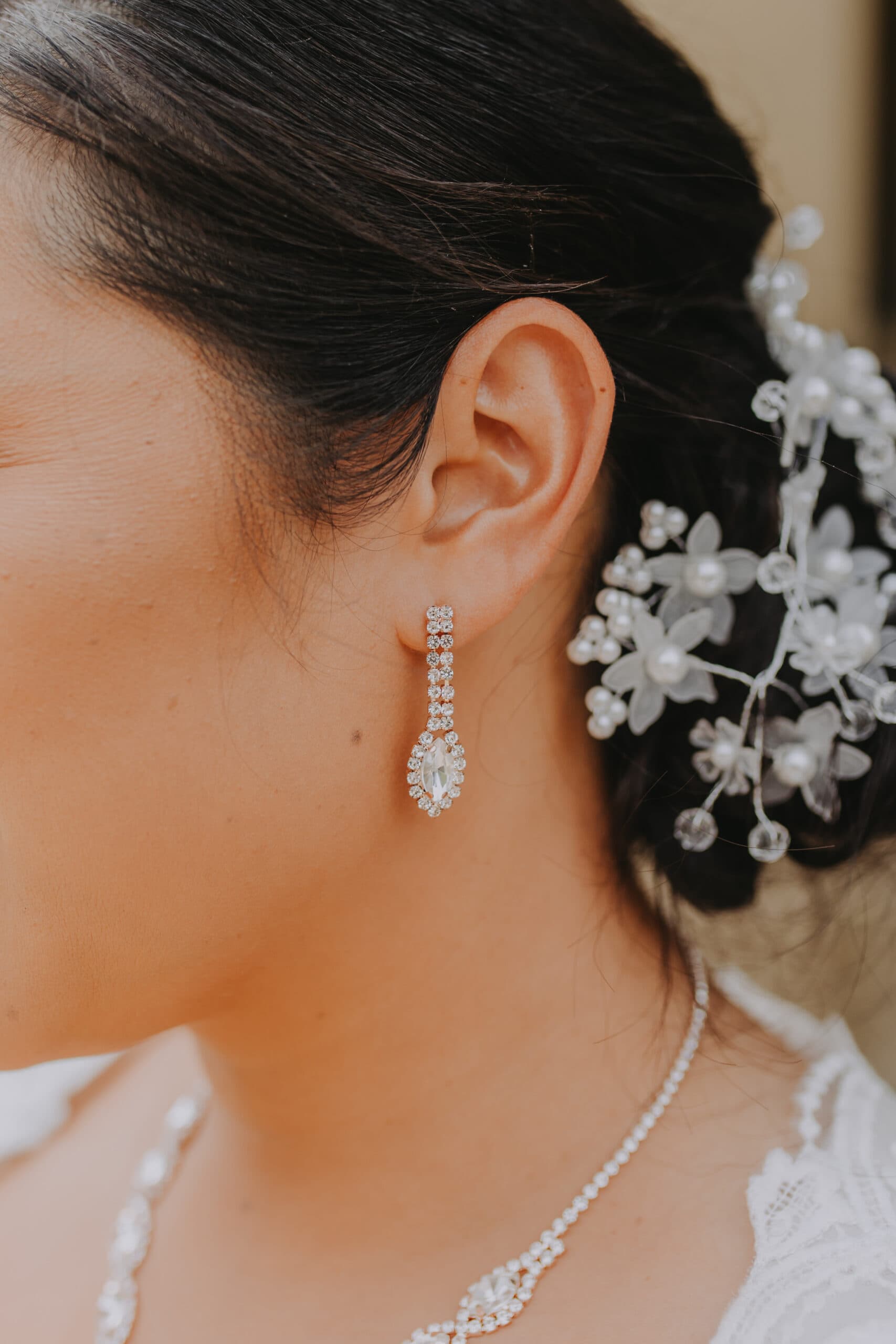 Wedding photography. A close up photo of a bride's earrings